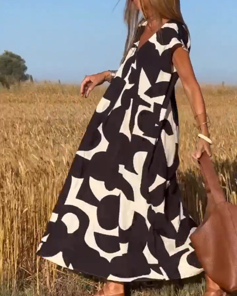 NAOMI | Robe Longue Imprimée avec Décolleté en V et Coupe Évasée pour un Look de Vacances