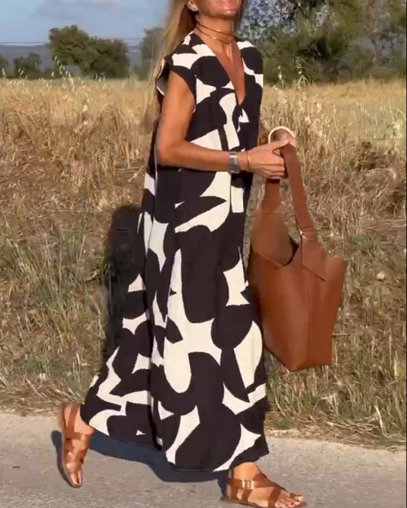 NAOMI | Robe Longue Imprimée avec Décolleté en V et Coupe Évasée pour un Look de Vacances