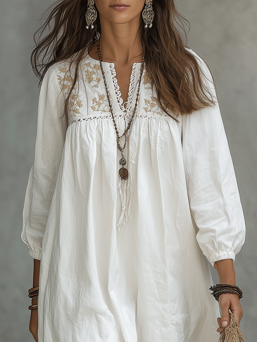 Robe maxi blanche bohémienne avec broderie florale et manches bouffantes