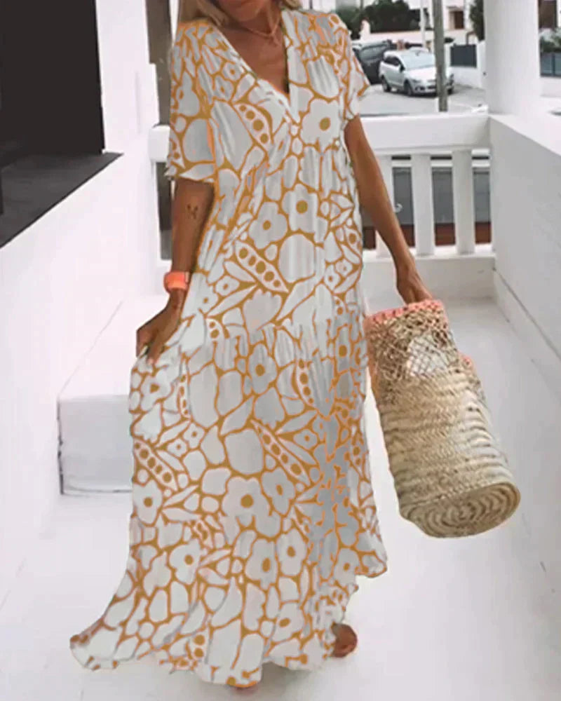 CHRISTINE | Robe d'été longue avec coupe fluide et motif graphique élégant