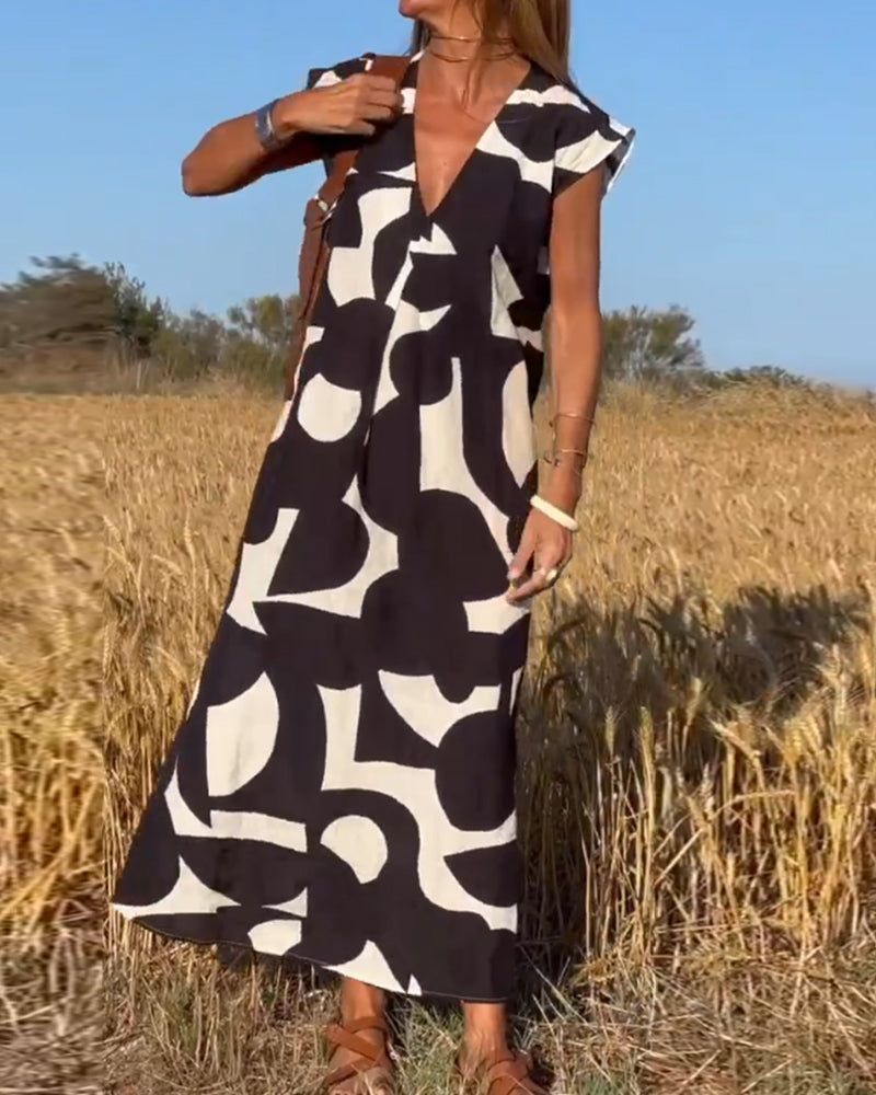 NAOMI | Robe Longue Imprimée avec Décolleté en V et Coupe Évasée pour un Look de Vacances