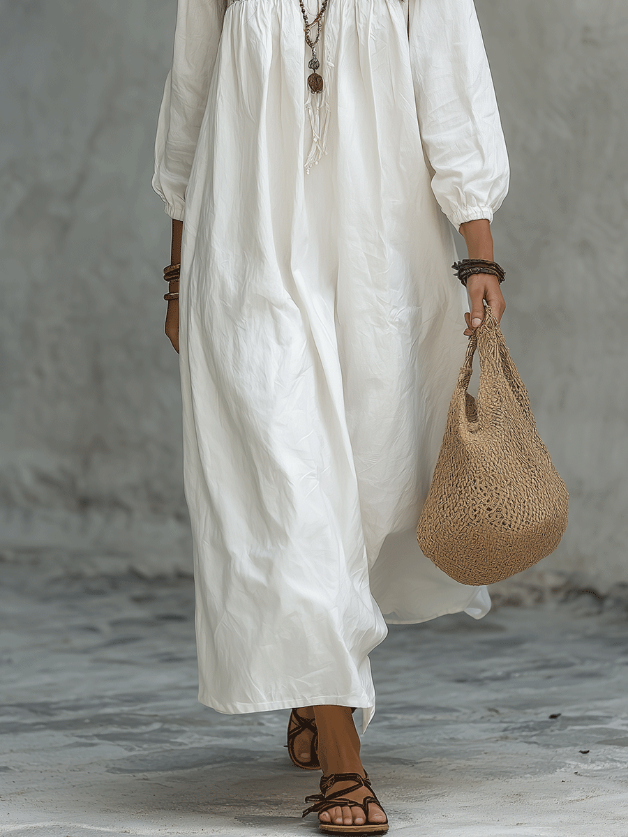 Robe maxi blanche bohémienne avec broderie florale et manches bouffantes