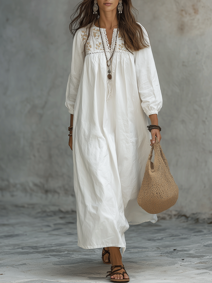 Robe maxi blanche bohémienne avec broderie florale et manches bouffantes